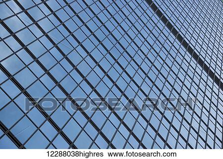Stock Photograph - Geometric pattern of window frames on skyscraper; Hong Kong, China. Fotosearch