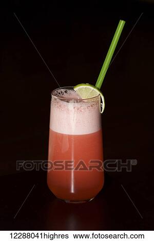 Glass of sherbet with lime and straw on a black background; Ankara, Turkey View Large Photo Image Stock Photograph - Glass of sherbet with lime and straw on a black background; Ankara, Turkey. Fotosearch