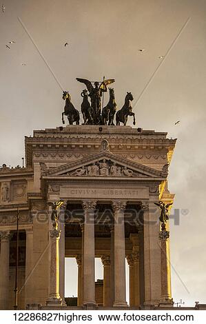 Stock Photograph - Goddess Victoria riding on quadriga; Rome, Italy. Fotosearch