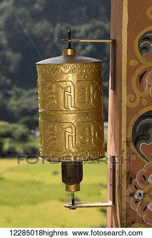 Stock Photograph - Gold prayer wheel; Bhutan. Fotosearch