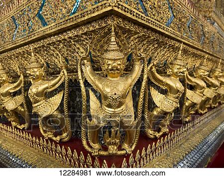 Gold statues in a row, Temple of the Emerald Buddha (Wat Phra Kaew); Bangkok, Thailand View Large Photo Image Stock Image - Gold statues in a row, Temple of the Emerald Buddha (Wat Phra Kaew); Bangkok, Thailand. Fotosearch