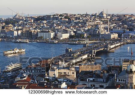 Golden hour view over waterfront of old Istanbul (Sultanahmet) with boats in the water; Istanbul, Turkey View Large Photo Image Stock Photograph - Golden hour view over waterfront of old Istanbul (Sultanahmet) with boats in the water; Istanbul, Turkey. Fotosearch