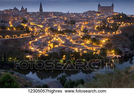Golden lights illuminate a historic city; Toledo, Castile-La Mancha, Spain View Large Photo Image Stock Photograph - Golden lights illuminate a historic city; Toledo, Castile-La Mancha, Spain. Fotosearch