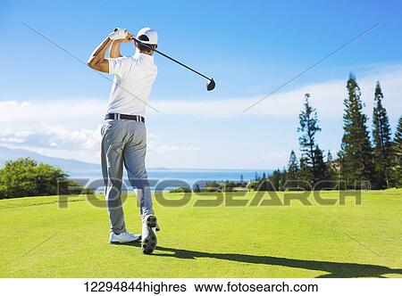 Golfer Hitting Ball with Club on Beautiful Golf Course View Large Photo Image Stock Photograph - Golfer Hitting Ball with Club on Beautiful Golf Course. Fotosearch