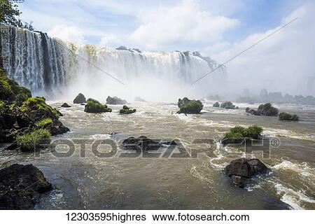 Stock Photograph - Grassy rocks at foot of Iguazu Falls; Parana, Brazil. Fotosearch
