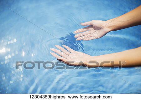 Hands in a pool; Island of Hawaii, Hawaii, United States of America View Large Photo Image Stock Photograph - Hands in a pool; Island of Hawaii, Hawaii, United States of America. Fotosearch