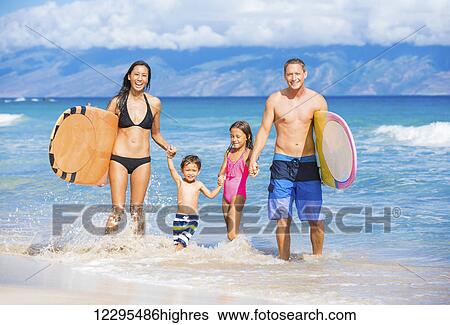 Happy Family with Surfboards on the Beach in Hawaii View Large Photo Image Stock Photograph - Happy Family with Surfboards on the Beach in Hawaii. Fotosearch