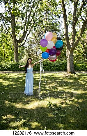 Stock Photograph - High school graduation, Queen Elizabeth Park; Vancouver, British Columbia, Canada. Fotosearch