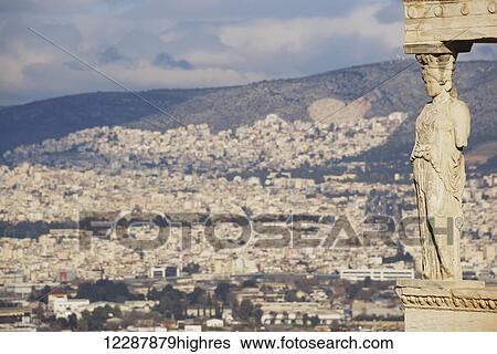 Stock Photograph - Hills of Athens seen behind Erechtheion caryatid; Athens, Attica, Greece. Fotosearch