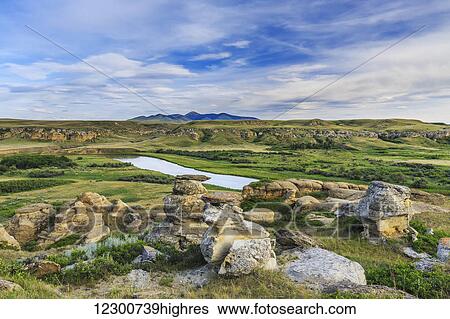 Stock Photograph - Hoodoos in the Badlands overlooking the Milk River, Writing-on-Stone Provincial Park; Alberta, Canada. Fotosearch