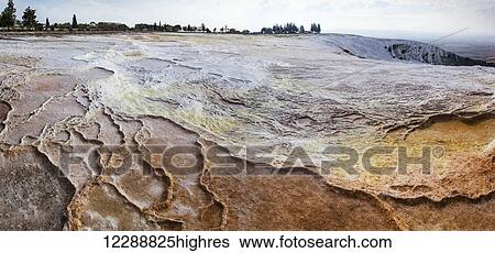 Hot springs and travertines, terraces of carbonate minerals left by the flowing water; Pamukkale, Turkey View Large Photo Image Stock Photograph - Hot springs and travertines, terraces of carbonate minerals left by the flowing water; Pamukkale, Turkey. Fotosearch