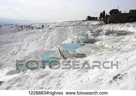 Hot springs and travertines, terraces of carbonate minerals left by the flowing water; Pamukkale, Turkey View Large Photo Image Stock Photograph - Hot springs and travertines, terraces of carbonate minerals left by the flowing water; Pamukkale, Turkey. Fotosearch