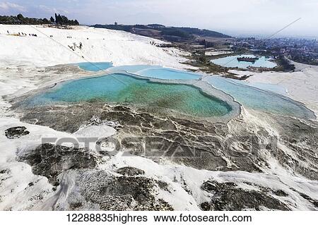 Hot springs and travertines, terraces of carbonate minerals left by the flowing water; Pamukkale, Turkey View Large Photo Image Stock Photograph - Hot springs and travertines, terraces of carbonate minerals left by the flowing water; Pamukkale, Turkey. Fotosearch