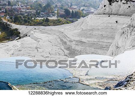 Hot springs and travertines, terraces of carbonate minerals left by the flowing water; Pamukkale, Turkey View Large Photo Image Stock Photograph - Hot springs and travertines, terraces of carbonate minerals left by the flowing water; Pamukkale, Turkey. Fotosearch