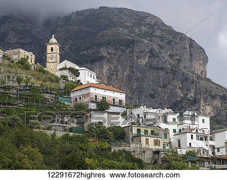 Houses on a hillside and a large mountain along the Amalfi coast; Amalfi, Italy View Large Photo Image Stock Photograph - Houses on a hillside and a large mountain along the Amalfi coast; Amalfi, Italy. Fotosearch