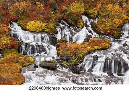 Stock Photograph - Hraunfossar waterfalls and autumn colours; Iceland. Fotosearch