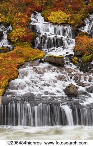 Stock Photograph - Hraunfossar waterfalls and autumn colours; Iceland. Fotosearch