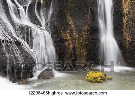 Stock Photograph - Hraunfossar waterfalls and autumn colours; Iceland. Fotosearch