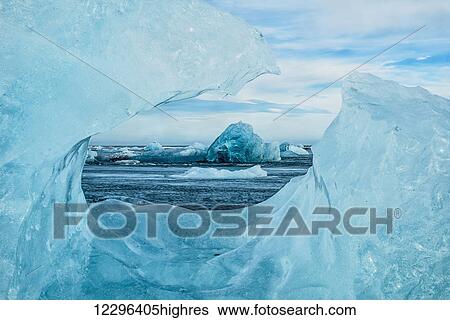 Stock Photograph - Icebergs on the southern beach near the ice lagoon of Jokursarlon; Iceland. Fotosearch