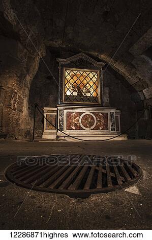 Stock Photograph - Inside the Mamertine Prison, this metal grate in the floor covers where the prisoners were lowered into their prison cell; Rome, Italy. Fotosearch
