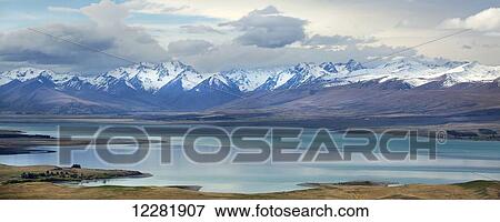 Lake Tekapo, with snow covered mountains; Tekapo, New Zealand View Large Photo Image Stock Photo - Lake Tekapo, with snow covered mountains; Tekapo, New Zealand. Fotosearch
