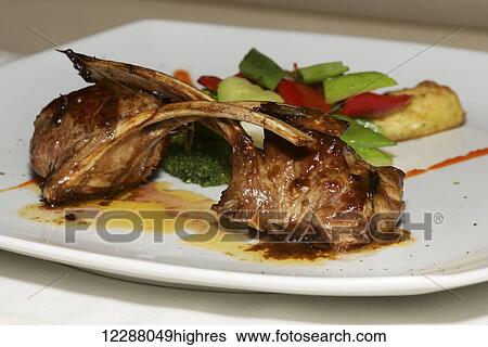 Lamb cutlets with vegetables on white plate; Ankara, Turkey View Large Photo Image Stock Photograph - Lamb cutlets with vegetables on white plate; Ankara, Turkey. Fotosearch