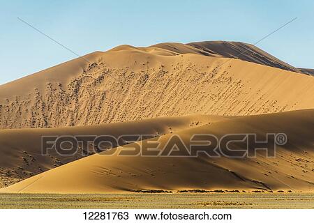 Large desert sand dunes; Sossusvlei, Namibia View Large Photo Image Stock Image - Large desert sand dunes; Sossusvlei, Namibia. Fotosearch