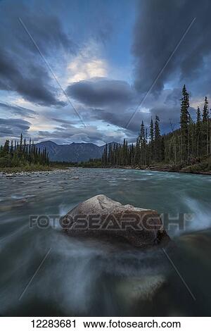 Late afternoon light over the Grey Ridge and the Wheaton River, near Whitehorse; Yukon, Canada View Large Photo Image Stock Image - Late afternoon light over the Grey Ridge and the Wheaton River, near Whitehorse; Yukon, Canada. Fotosearch