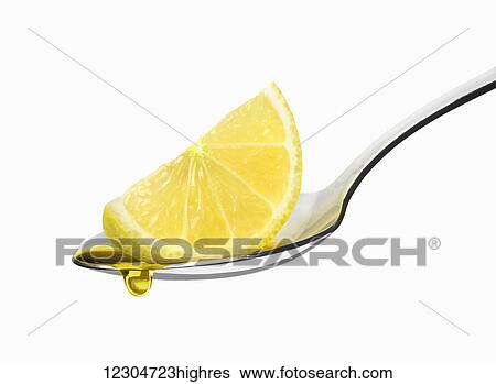 Lemon wedge on a spoon on a white background with a droplet of liquid falling from the rind; Toronto, Ontario, Canada View Large Photo Image Stock Photograph - Lemon wedge on a spoon on a white background with a droplet of liquid falling from the rind; Toronto, Ontario, Canada. Fotosearch