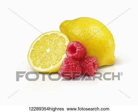 Stock Photograph - Lemons and raspberries; Toronto, Ontario, Canada. Fotosearch