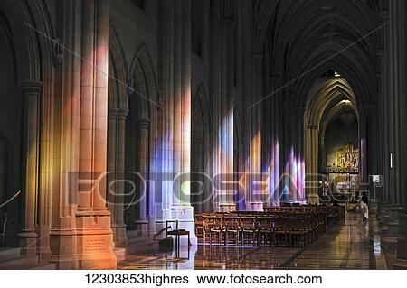 Light streaming through stained glass windows with colourful light columns along the cathedral nave, altarpiece in St. Mary's Chapel visible background; Washington, District of Columbia, United States of America View Large Photo Image Stock Photograph - Light streaming through stained glass windows with colourful light columns along the cathedral nave, altarpiece in St. Mary's Chapel visible background; Washington, District of Columbia, United States of America. Fotosearch