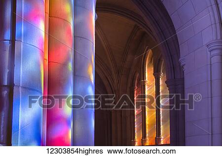Light streaming through stained glass windows with colourful light columns along the cathedral nave; Washington, District of Columbia, United States of America View Large Photo Image Stock Photograph - Light streaming through stained glass windows with colourful light columns along the cathedral nave; Washington, District of Columbia, United States of America. Fotosearch