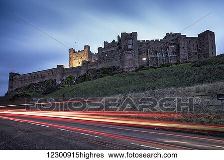 Light trails on the road and Bamburgh Castle; Bamburgh, Northumberland, England View Large Photo Image Stock Photograph - Light trails on the road and Bamburgh Castle; Bamburgh, Northumberland, England. Fotosearch