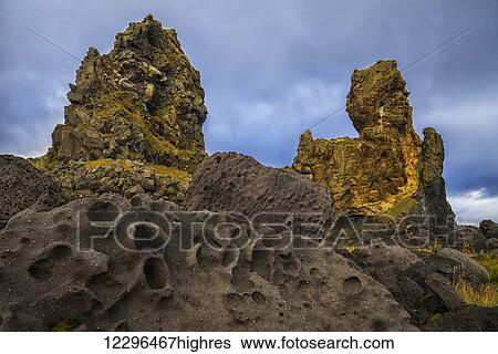 Stock Photograph - Londranger is an ancient sea stack along the coast of the Snaefellsness Peninsula; Iceland. Fotosearch