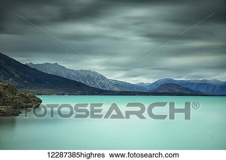 Long exposure over top of Atlin Lake; British Columbia, Canada View Large Photo Image Stock Photograph - Long exposure over top of Atlin Lake; British Columbia, Canada. Fotosearch
