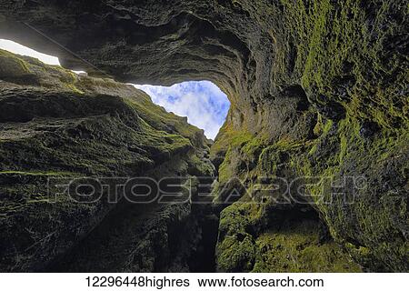Stock Photograph - Looking straight up out of a chasm on Iceland's Snaefellsness Peninsula; Iceland. Fotosearch