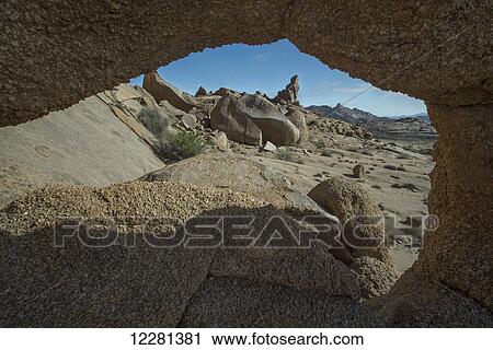 Looking through a hole in the rocks at the landscape of Richtersveld National Park; South Africa View Large Photo Image Stock Image - Looking through a hole in the rocks at the landscape of Richtersveld National Park; South Africa. Fotosearch