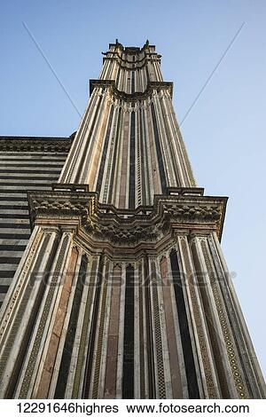 Stock Photograph - Low angle view of a striped facade of a tower at Orvieto Cathedral; Orvieto, Umbria, Italy. Fotosearch