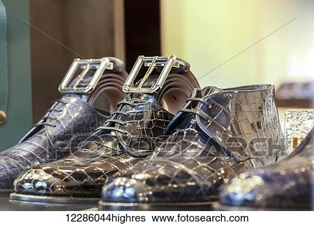 Stock Photograph - Luxury leather Italian footwear and accessories on display in the fashion district; Milan, Italy. Fotosearch