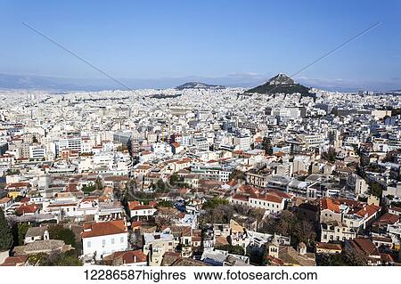 Stock Photograph - Lykavittos Hill and cityscape of Athens; Athens, Greece. Fotosearch