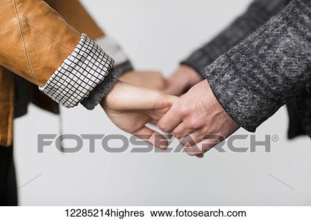 Man and woman holding hands; Toronto, Ontario, Canada View Large Photo Image Stock Photograph - Man and woman holding hands; Toronto, Ontario, Canada. Fotosearch