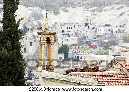 Stock Photograph - Man-made cave dwellings; Goreme, Cappadocia, Turkey. Fotosearch