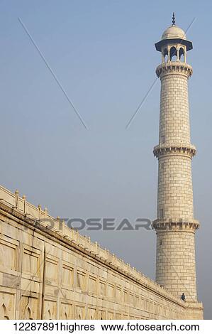 Man standing next to Taj minaret; Agra, Uttar Pradesh, India View Large Photo Image Stock Photograph - Man standing next to Taj minaret; Agra, Uttar Pradesh, India. Fotosearch