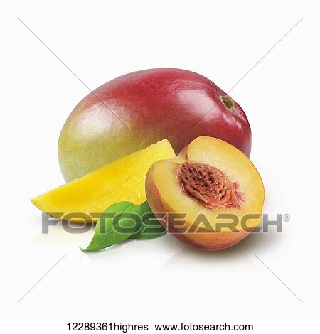 Mango and half of a peach with leaves on a white background; Toronto, Ontario, Canada View Large Photo Image Stock Photograph - Mango and half of a peach with leaves on a white background; Toronto, Ontario, Canada. Fotosearch