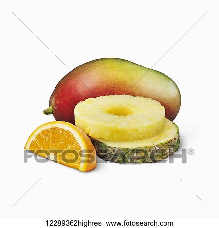 Mango, pineapple slices and orange wedge on a white background; Toronto, Ontario, Canada View Large Photo Image Stock Photograph - Mango, pineapple slices and orange wedge on a white background; Toronto, Ontario, Canada. Fotosearch