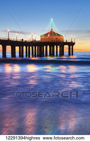 Manhattan Beach Pier at sunset, completed in 1920, Roundhouse Marine Studies Lab and Aquarium (octagonal building, end of pier); Manhattan Beach, California, United States of America View Large Photo Image Stock Photograph - Manhattan Beach Pier at sunset, completed in 1920, Roundhouse Marine Studies Lab and Aquarium (octagonal building, end of pier); Manhattan Beach, California, United States of America. Fotosearch