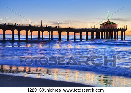 Manhattan Beach Pier at sunset, completed in 1920, Roundhouse Marine Studies Lab and Aquarium (octagonal building, end of pier); Manhattan Beach, California, United States of America View Large Photo Image Stock Photograph - Manhattan Beach Pier at sunset, completed in 1920, Roundhouse Marine Studies Lab and Aquarium (octagonal building, end of pier); Manhattan Beach, California, United States of America. Fotosearch