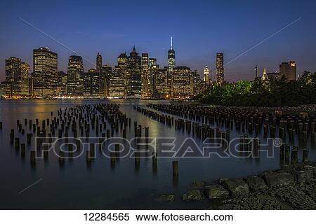 Manhattan skyline at twilight, Brooklyn Bridge Park; Brooklyn, New York, United States of America View Large Photo Image Stock Photography - Manhattan skyline at twilight, Brooklyn Bridge Park; Brooklyn, New York, United States of America. Fotosearch