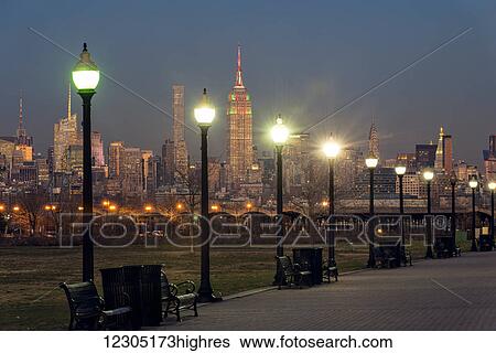 Stock Photograph - Manhattan skyline at twilight, Liberty State Park; Jersey City, New Jersey, United States of America. Fotosearch