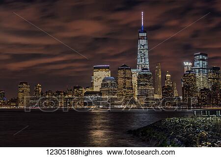 Stock Photograph - Manhattan skyline at twilight, Liberty State Park; Jersey City, New Jersey, United States of America. Fotosearch